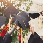 Graduates celebrating, grads' caps