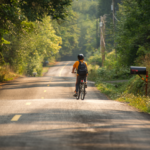 Child riding bike on rural road